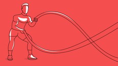 Strong bodybuilder sportsman man with battle rope doing exercise in functional training fitness gym