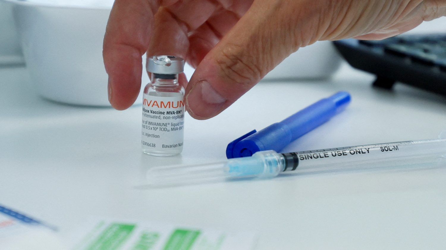 a healthcare worker prepares a syringe at a monkeypox vaccination clinic run by ciusss public health authorities in montreal, quebec, canada, june 6, 2022.  reuters/christinne muschi/file photo