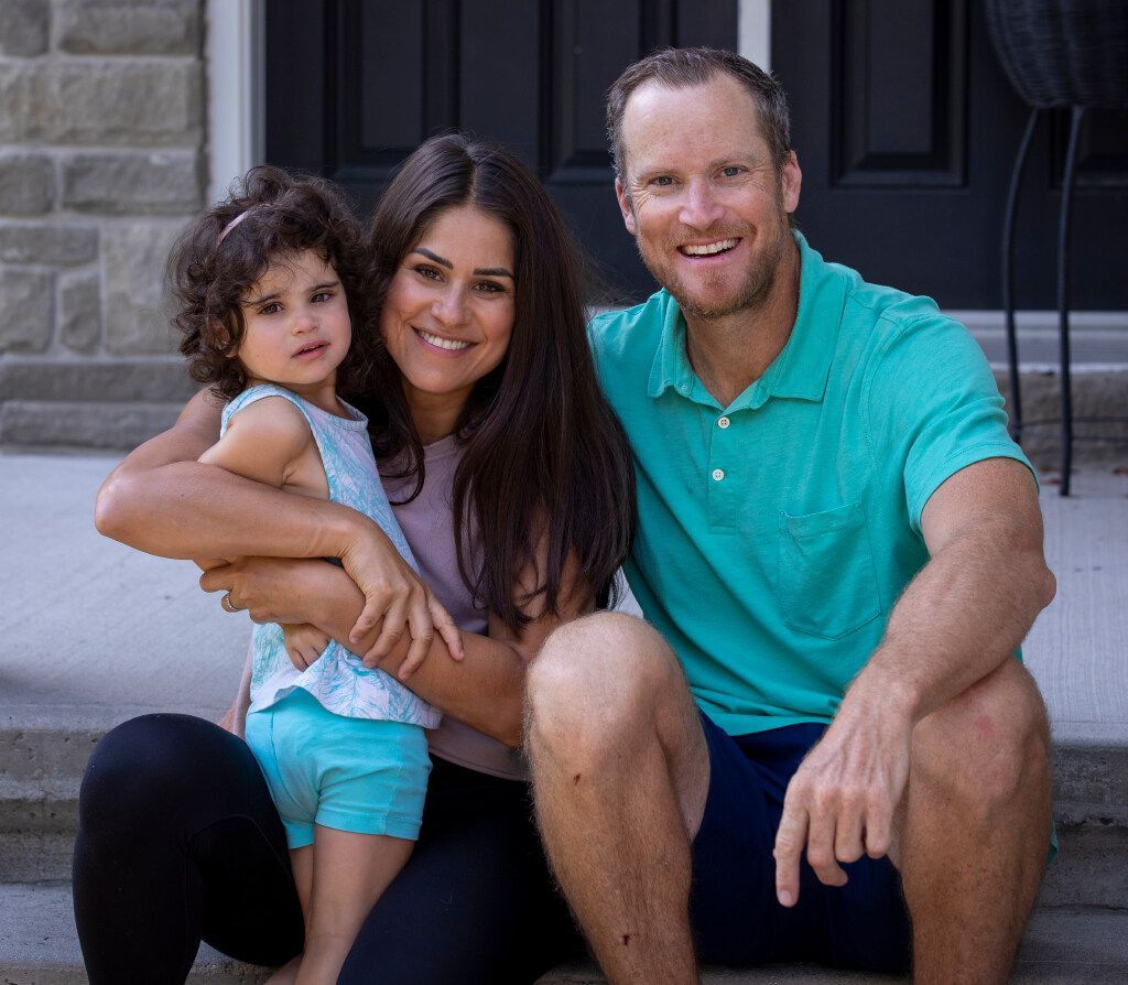 Keely and Steve McJannet with their three-year-old daughter Hazel, who was born with CMV, which can cause hearing loss and development delays.