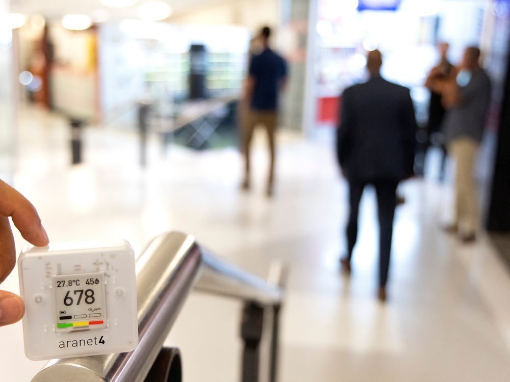 a co2 monitor displays a reading of 678 parts per million at the entrance to an underground food court in montreal.