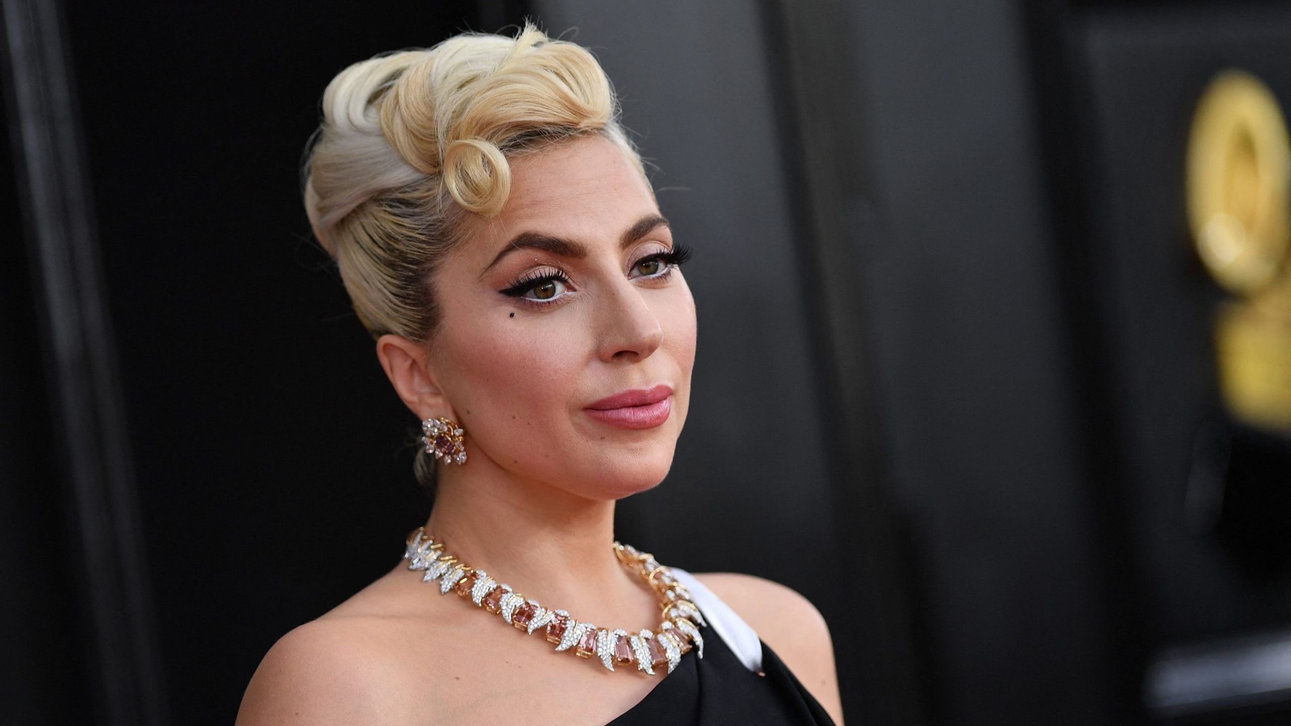 (FILES) In this file photo taken on April 03, 2022, US singer-songwriter Lady Gaga arrives for the 64th Annual Grammy Awards at the MGM Grand Garden Arena in Las Vegas. - US authorities on July 20, 2022, were searching for the suspect accused of shooting Lady Gaga's dog walker in 2021, months after he was accidentally released from custody. (Photo by ANGELA WEISS / AFP) (Photo by ANGELA WEISS/AFP via Getty Images)