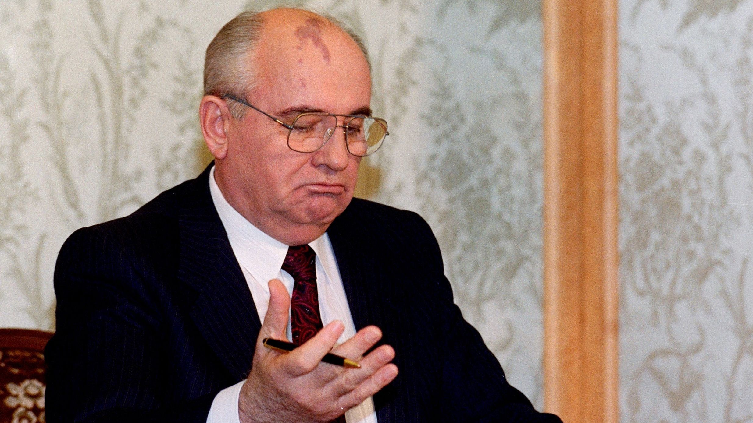 (FILES) In this file photo taken on December 25, 1991 Soviet President Mikhail Gorbachev reads his resignation statement shortly before appearing on television in Moscow, to announce his decision to the Nation. - The last leader of the Soviet Union, Mikhail Gorbachev, died on August 30, 2022 at the age of 91 in Russia, said a hospital quoted by Russian news agencies. (Photo by VITALY ARMAND / AFP) (Photo by VITALY ARMAND/AFP via Getty Images)