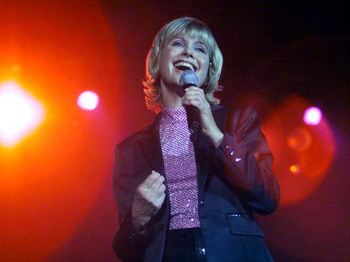 FILE: Olivia Newton-John sings at her "Greatest Hits Live" concert in Hong Kong Aug. 18, 2000. /