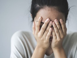 Mom covering her face with her hands