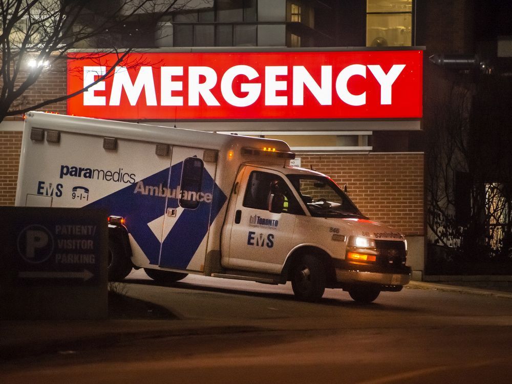 file photo: an ambulance leaves the emergency area of toronto western hospital during the covid-19 pandemic.