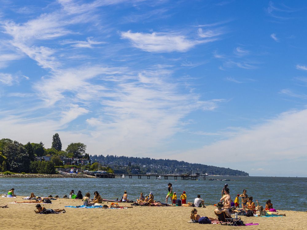 vancouver beachgoers enjoy the sunshine on july 21, 2022.