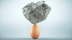 Rock standing on egg. Unstoppable and strong idea concept. This is a 3d render illustration