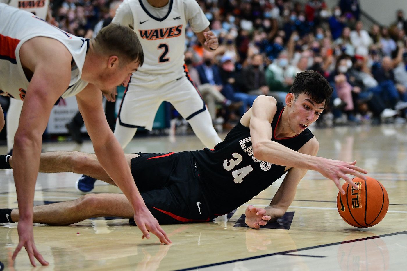 Chet Holmgren (34 - pictured playing centre for Gonzaga Bulldogs), who is now dealing with a Lisfranc injury, plays for the ball against Pepperdine Waves forward Jan Zidek (31) during the second half at Firestone Fieldhouse  on Feb 16.
