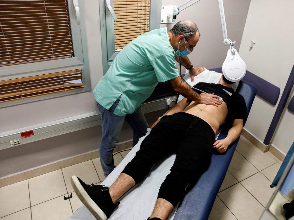 a patient suffering from long covid is examined in the post-covid-19 clinic of ichilov hospital in tel aviv, israel, feb. 21, 2022.