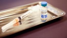 a vial of the measles, mumps, and rubella (mmr) vaccine is pictured.