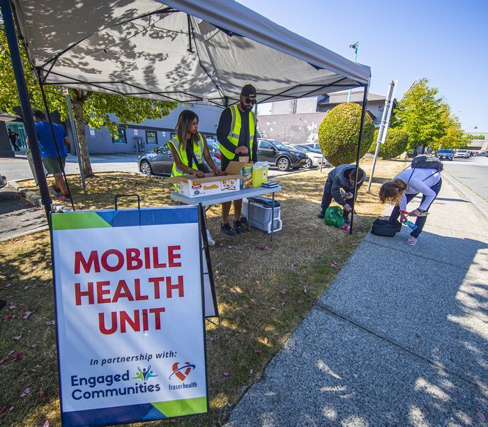 engaged communities workers provide water and food to people who are in need.