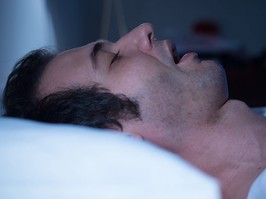 Man sleeping with sleep apnea