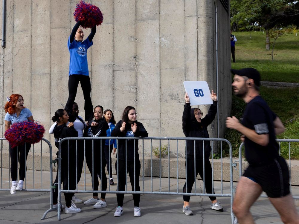 cheerleaders from collège de maisonneuve help motivate runners during the montreal marathon in september.