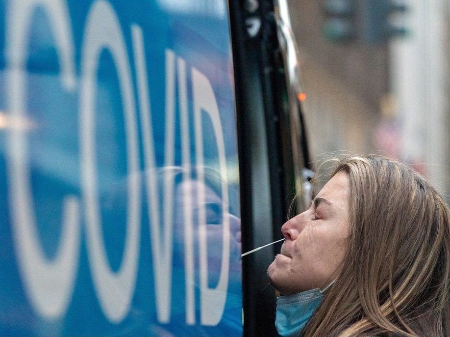 a woman takes a coronavirus disease (covid-19) test at a pop-up testing site as the omicron coronavirus variant continues to spread in manhattan, new york city, u.s., december 27, 2021.