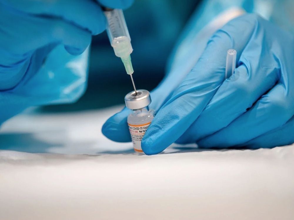 A nurse prepares the Pfizer-BioNTech COVID-19 vaccine in Montreal, Que.