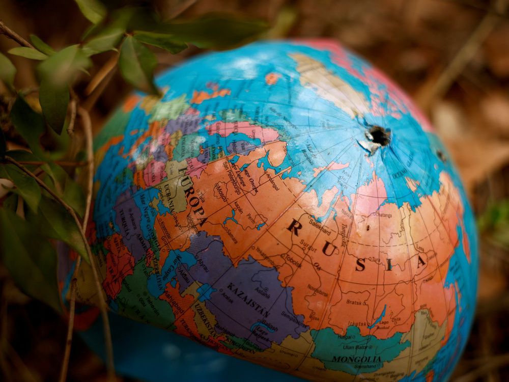 a broken globe lies on the ground in a park in ronda, southern spain, october 16, 2022. "it’s the most thoughtful and insightful millennials and generation z-ers who are most deeply troubled by a disease that i’m labelling 'globophobia,' fear of the world," montreal psychiatrist gerald wiviott writes.