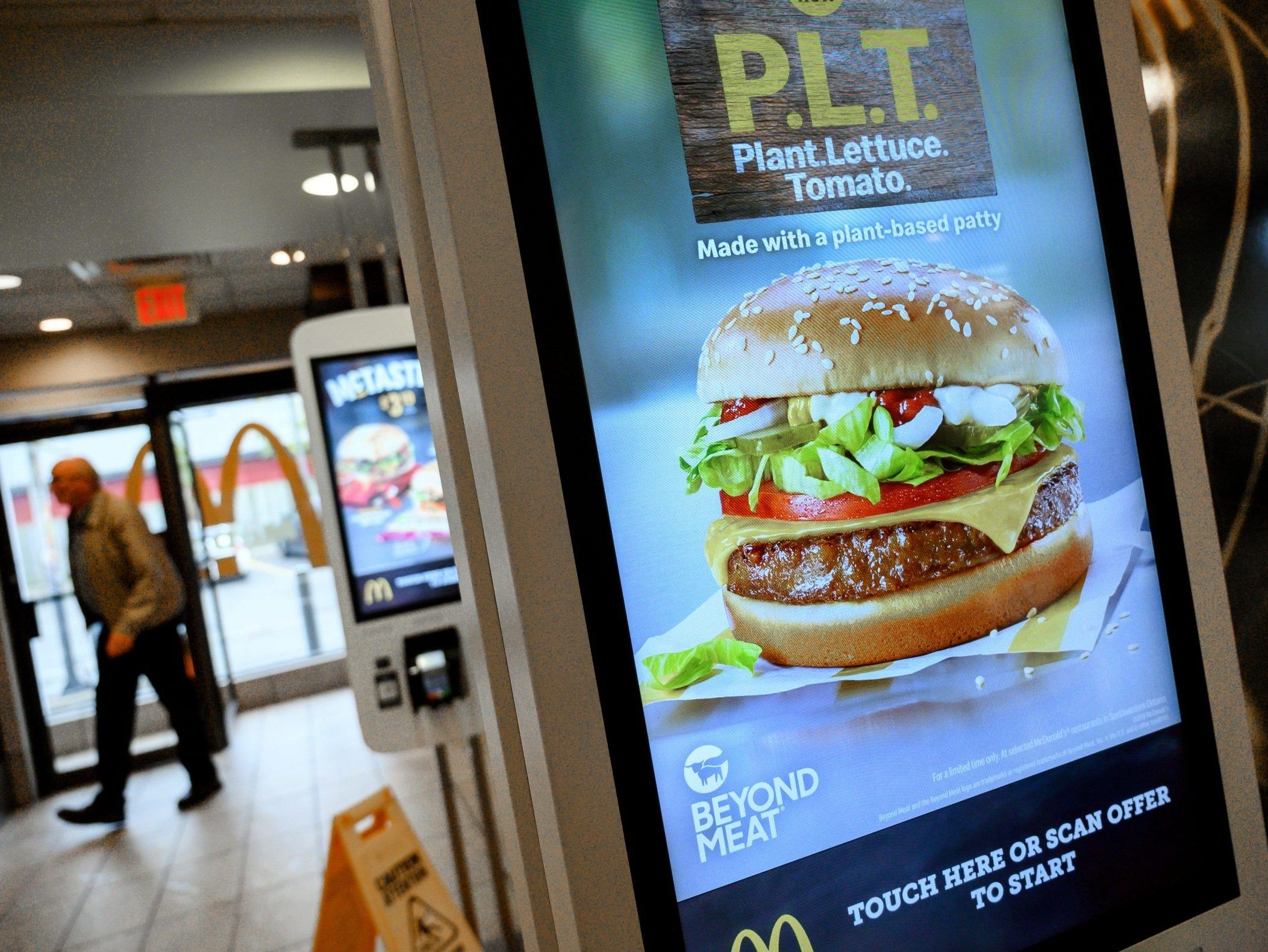 a sign promoting mcdonald's "plt" burger with a beyond meat plant-based patty at one of 28 test restaurant locations in london, ontario, canada october 2, 2019.