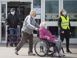 Visitors to the COVID-19 vaccination clinic at the WFCU Centre in Windsor on March 9, 2021.