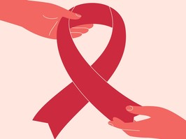 Pink or red ribbon is passing from hand to hand. Breast cancer awareness concept with human arms giving big pink ribbon. Aids symbol.