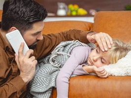 dad with daughter lying on couch