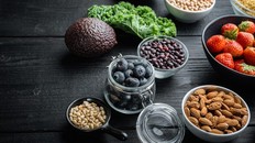 bowls of berries and nuts