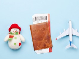 image of snowman, passport and toy airplane