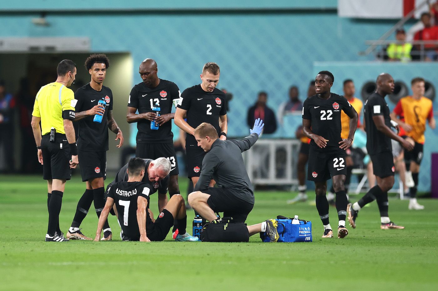 doha, qatar - november 27: stephen eustaquio of canada receives medical attention during the fifa world cup qatar 2022 group f match between croatia and canada at khalifa international stadium on november 27, 2022 in doha, qatar. (photo by alex grimm/getty images)