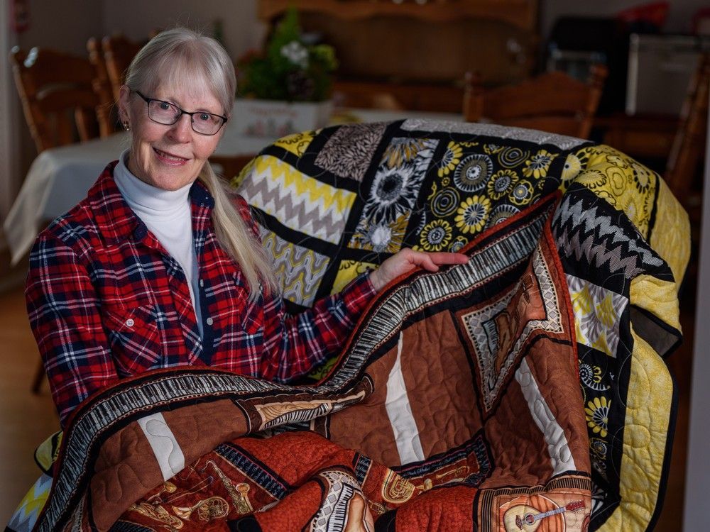 team leader of the okotoks branch of victoria's quilts patricia litke, a charity which makes free handmade quilts for people living with caner, poses for a portrait at her home in calgary on thursday, december 29, 2022. azin ghaffari/postmedia