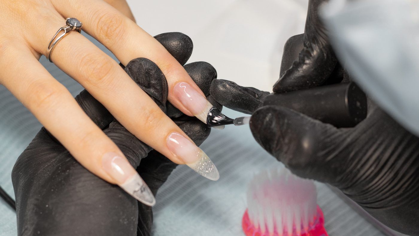 people often go for acrylic nails because of their durability and artistry. getty