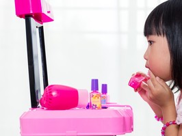 Asian Chinese Liitle Girl Playing With Make-Up Toys