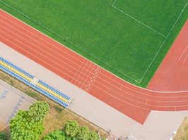 red synthetic rubber running track on stadium