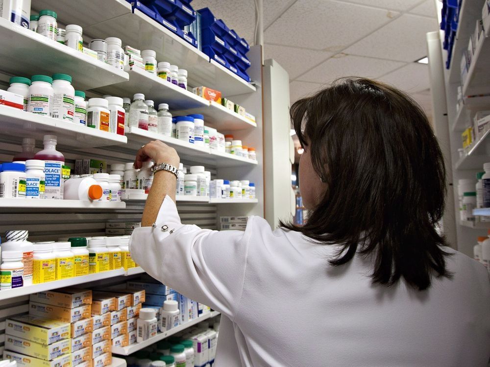 a lab technician prepares a prescription at a pharmacy in quebec city, thursday, march 8, 2012.