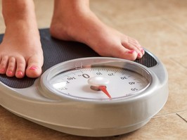 Female feet on weight scale