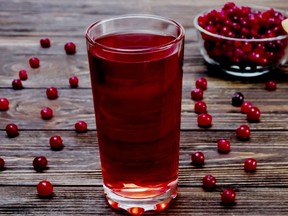 cranberries in a bowl and cranberry juice