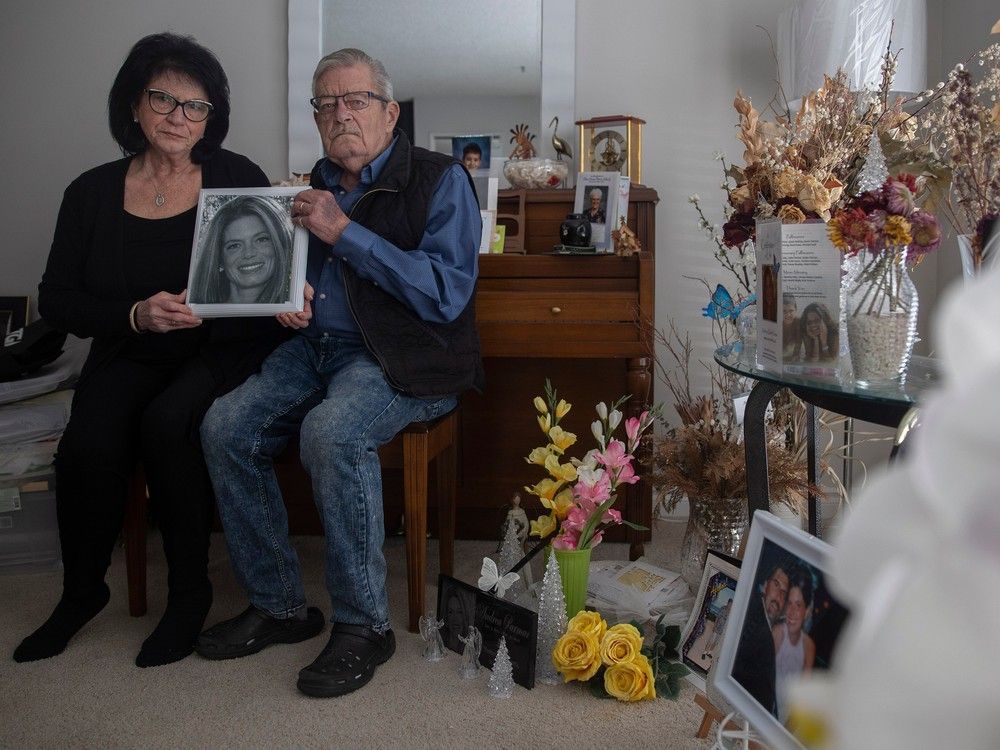 gwen gilbert and brian gilbert hold a picture of their late daughter andrea parmar, who died in the yorkton hospital icu at the end of march in 2022, of covid-19 related complications. the portrait is taken in the gilbert home on monday, march 27, 2023 in regina.