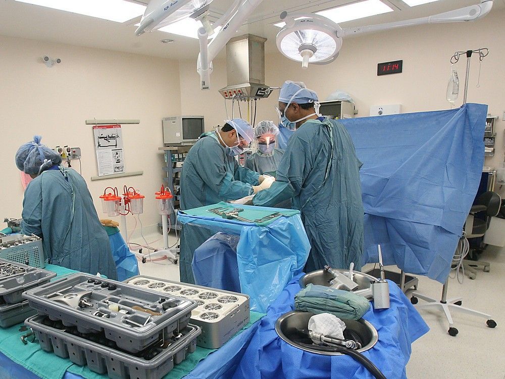 Hip replacement surgery is performed in this November 2006 photo.