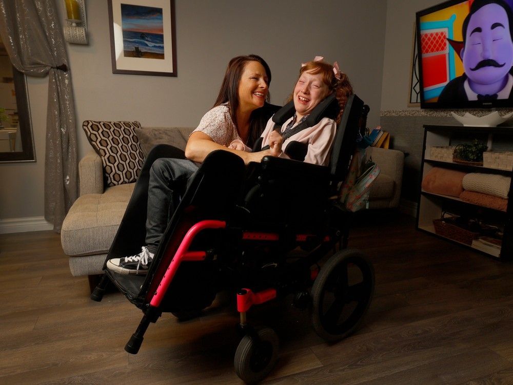 linda tabet and her daughter, chloe, enjoy smiles together. chloe was born with a genetic illness so rare that hers is one of just about 20 cases in the world.