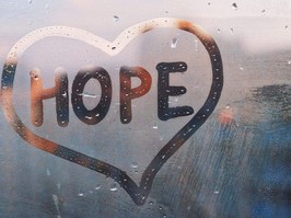 foggy window with the words hope