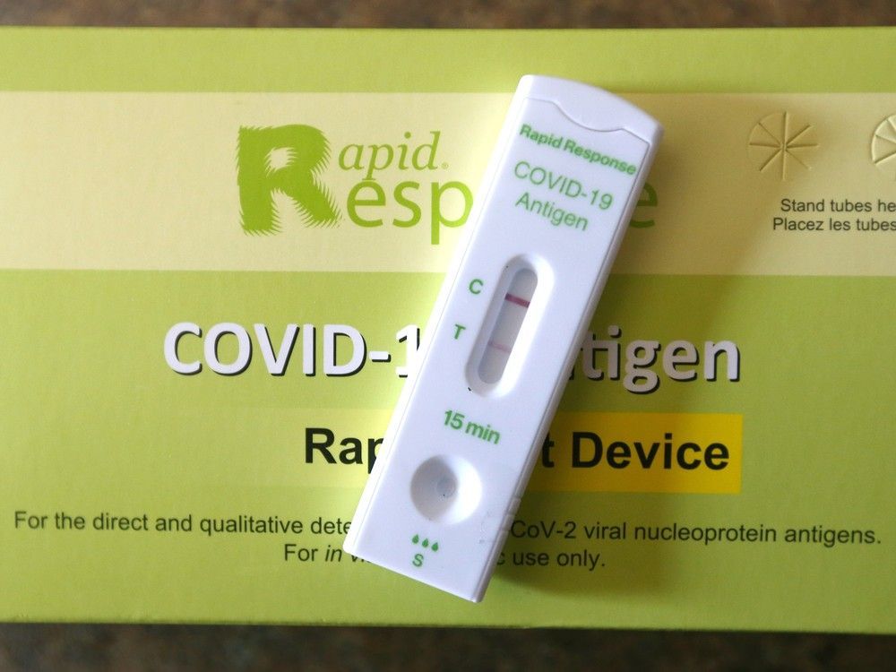 A positive result for an at home COVID-19 rapid test is shown near Calgary on Friday, January 14, 2022. the province says the end of the rapid test program represents a shift to PCR testing — tests that produce results confirmed in a lab and take longer.