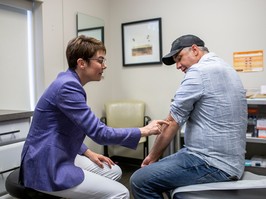 “Having open conversations with your doctor is important — fighting embarrassment starts at the doctor’s office,” says Daryl Scott, seen here with his dermatologist, Dr. Melinda Gooderham. Photo: Nick Kozak