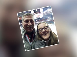 Shannon and Claude - selfie of man and woman at a hockey game