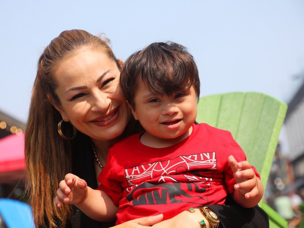 dina daaboul and her son, yousef, who received four routine childhood vaccines — two in each arm — at a special vaccinate and up to date clinic run by the kids come first health team.