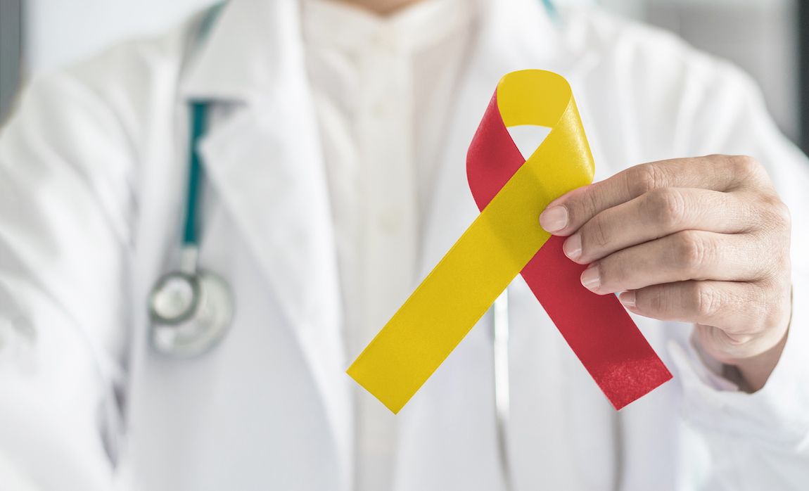 A red and yellow ribbon is the symbol for hepatitis awareness.
