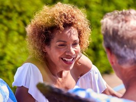 happy retired man and woman talking