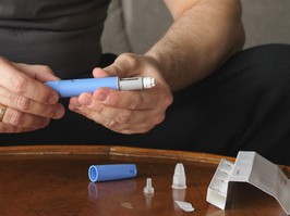 man preparing Semaglutide Ozempic injection control blood sugar levels