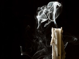Blown out candle symbolizes the burnout among healthcare advocates