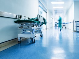 Doctors or nurses walking in hospital hallway, blurred motion