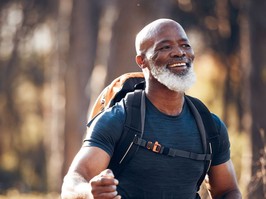 Fitness, hiking and smile with black man in forest for freedom