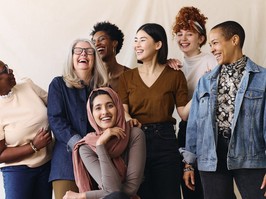 Portrait of cheerful mixed age range multi ethnic women celebrating International Women's Day