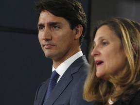 Canada's Prime Minister Justin Trudeau (L) and Minister of Foreign Affairs Chrystia Freeland (R) speak at a press conference to announce the new trade with between Canada, the United States, and Mexico in Ottawa, October 1, 2018. - Trudeau hailed a continental trade deal reached with the United States, along with Mexico, as "profoundly beneficial" to Canadians. "It is an agreement that will be profoundly beneficial for our economy, for Canadian families and for the middle class," Trudeau told a news conference hours after a new US-Mexico-Canada Agreement was reached in the eleventh-hour overnight talks. (Photo by PATRICK DOYLE / AFP) (Photo credit should read PATRICK DOYLE/AFP via Getty Images)